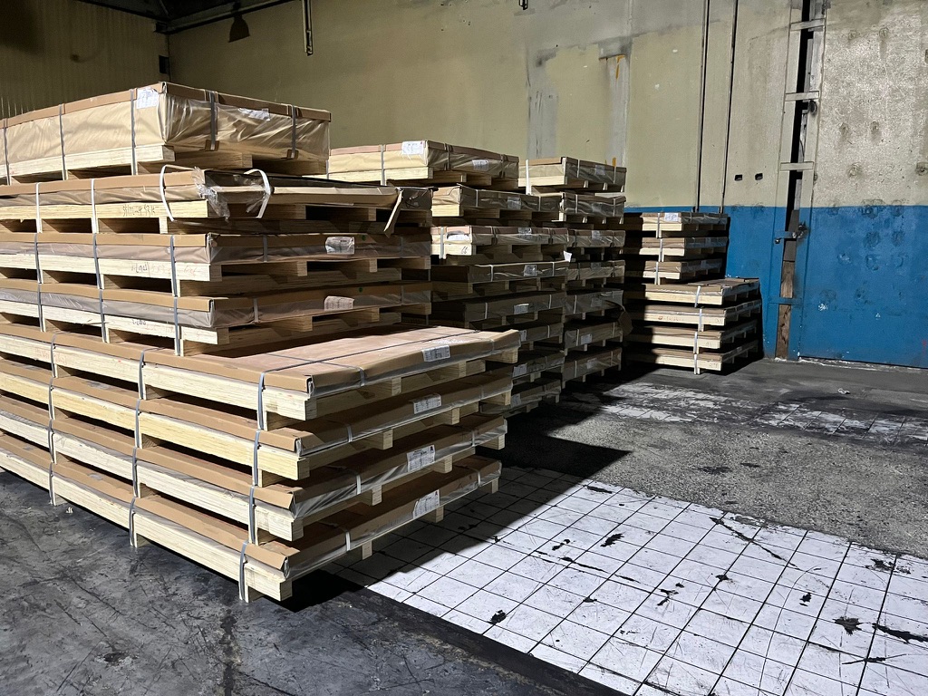 Industrial metal products stored on pallets in a loading yard