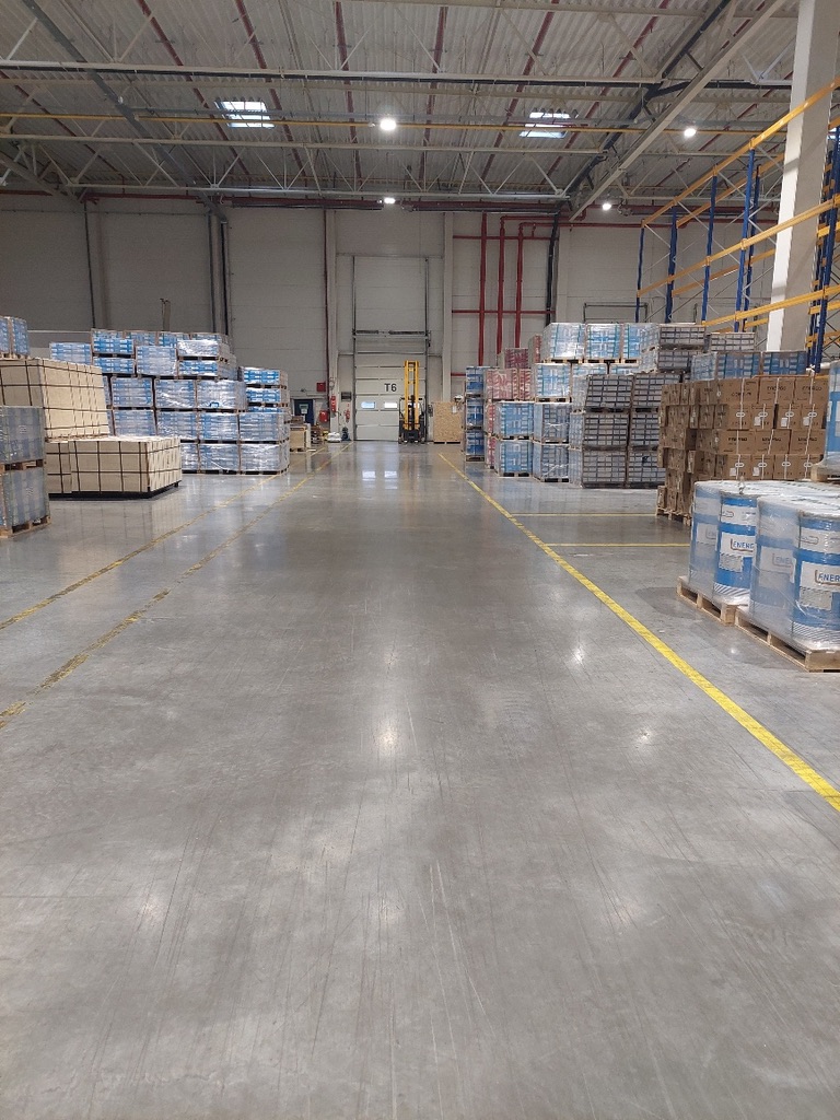 Wide view of a warehouse with palletized goods